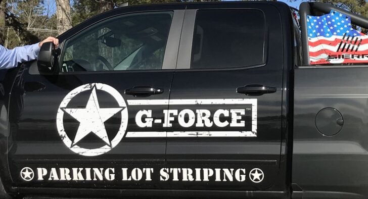 g-force founder jack child standing in front of truck
