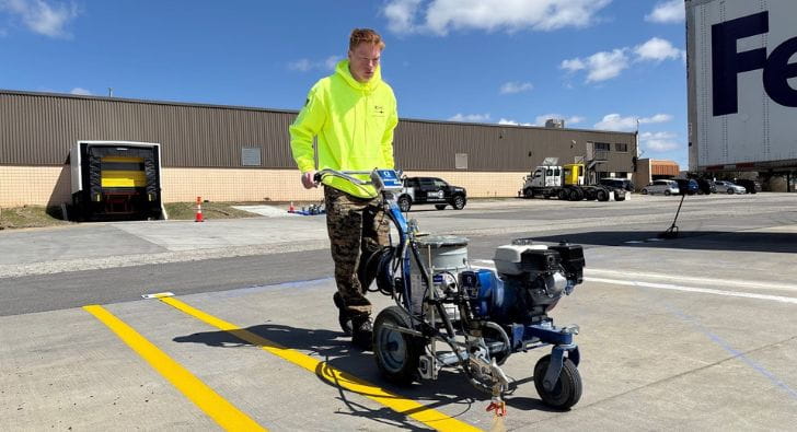G-FORCE owner operating striping machine